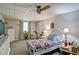 Cozy bedroom featuring a comfortable bed, ceiling fan, and dresser for ample storage at 809 Longbranch Ln, Douglasville, GA 30134