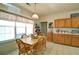 Cozy dining area featuring a wooden table, chairs, and natural light, set next to the kitchen at 809 Longbranch Ln, Douglasville, GA 30134