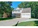 Traditional two-story home with attached garage, set on a large lot at 809 Longbranch Ln, Douglasville, GA 30134