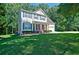 Two-story home with blue shutters, covered porch, and a well-manicured lawn at 809 Longbranch Ln, Douglasville, GA 30134