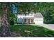 Charming two-story house with blue shutters and an attached two-car garage at 809 Longbranch Ln, Douglasville, GA 30134