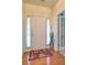 Entryway with hardwood floors, decorative rug, and a view of a french door at 809 Longbranch Ln, Douglasville, GA 30134
