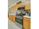 Updated kitchen boasts wood cabinets, modern stainless-steel appliances, and smooth countertops for efficient cooking at 809 Longbranch Ln, Douglasville, GA 30134