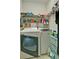 Functional laundry room with shelving and updated machines at 809 Longbranch Ln, Douglasville, GA 30134