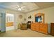 Lovely main bedroom with ensuite bathroom, ceiling fan, wooden dresser and comfortable chair at 809 Longbranch Ln, Douglasville, GA 30134