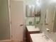 Bright bathroom with double sinks and mirrors at 1144 Country Ct, Lawrenceville, GA 30044