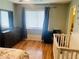 Bedroom with a large window and dresser at 1144 Country Ct, Lawrenceville, GA 30044