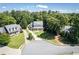 Residential neighborhood featuring manicured lawns, mature trees, and well-maintained homes at 395 Grove Ridge Dr, Loganville, GA 30052