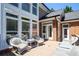 Outdoor deck features wicker furniture, perfect for relaxing and enjoying the backyard view at 395 Grove Ridge Dr, Loganville, GA 30052