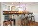 Finished basement bar features granite counters, white cabinets, and a stainless steel beverage fridge at 395 Grove Ridge Dr, Loganville, GA 30052
