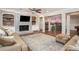 Finished basement with a fireplace and a bar area for entertaining at 395 Grove Ridge Dr, Loganville, GA 30052
