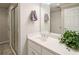 Clean bathroom features a white vanity with a framed mirror and walk-in shower at 395 Grove Ridge Dr, Loganville, GA 30052