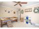 Cozy bedroom featuring whimsical decorations, and a wooden toddler bed at 395 Grove Ridge Dr, Loganville, GA 30052