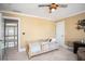 Comfortable bedroom featuring neutral colors, a baseball themed ceiling fan and lots of light at 395 Grove Ridge Dr, Loganville, GA 30052