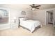 Cozy bedroom with soft carpet, and adjacent bathroom at 395 Grove Ridge Dr, Loganville, GA 30052