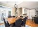 An open dining area adjacent to the kitchen with views of the staircase and entryway at 395 Grove Ridge Dr, Loganville, GA 30052