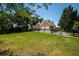 Charming home with a manicured lawn, two-car garage, and a classic fence enclosing the property at 395 Grove Ridge Dr, Loganville, GA 30052