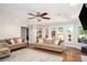 Bright living room featuring hardwood floors and large windows at 395 Grove Ridge Dr, Loganville, GA 30052