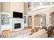 Living room features fireplace, built-in shelving, and staircase at 395 Grove Ridge Dr, Loganville, GA 30052