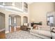 Spacious living room featuring soaring ceilings and open floor plan at 395 Grove Ridge Dr, Loganville, GA 30052