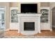Cozy living room with fireplace, built-in shelves, and natural light at 395 Grove Ridge Dr, Loganville, GA 30052