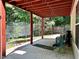 Covered patio for outdoor entertaining with views of the backyard at 627 Arbour Way, Suwanee, GA 30024