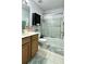 Cozy bathroom with shower and tub combo, vanity, and tile floors at 627 Arbour Way, Suwanee, GA 30024