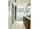 Bright bathroom with a soaking tub, double vanity, and a separate shower at 627 Arbour Way, Suwanee, GA 30024