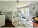 Charming bedroom featuring a bunk bed with a slide, bright natural light, and playful decor at 627 Arbour Way, Suwanee, GA 30024
