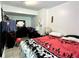 Comfortable bedroom setup with ample dresser storage space and bright light fixture at 627 Arbour Way, Suwanee, GA 30024