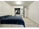Spacious bedroom featuring closet and doorway to another room at 627 Arbour Way, Suwanee, GA 30024