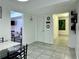 Spacious dining room featuring neutral walls, tile floors, and natural light at 627 Arbour Way, Suwanee, GA 30024