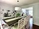 Open dining room area featuring a long table with seating for Gathering and friends at 627 Arbour Way, Suwanee, GA 30024