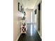 Inviting foyer with tile flooring, white shelving, and view of the front door at 627 Arbour Way, Suwanee, GA 30024