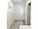 Hallway with tile flooring leading to door at 627 Arbour Way, Suwanee, GA 30024