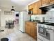 Well-equipped kitchen featuring stainless steel appliances and tile backsplash at 627 Arbour Way, Suwanee, GA 30024