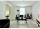 Inviting living room with neutral walls, tile floors, and contemporary furniture at 627 Arbour Way, Suwanee, GA 30024