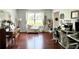 Bright living room with beautiful hardwood floors, natural light and a built-in window seat at 627 Arbour Way, Suwanee, GA 30024