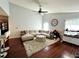 Open concept living room with vaulted ceilings and a comfortable sectional sofa at 627 Arbour Way, Suwanee, GA 30024