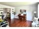 Cozy living room with hardwood floors, piano, lots of natural light, and neutral colored walls at 627 Arbour Way, Suwanee, GA 30024