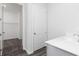 Bathroom featuring a white vanity and an attached closet space at 1517 Ellie Ridge Ave, Lawrenceville, GA 30043