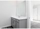 Bathroom featuring a grey vanity and a large mirror above it at 1517 Ellie Ridge Ave, Lawrenceville, GA 30043