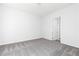 Bright bedroom with gray carpet and white walls at 1517 Ellie Ridge Ave, Lawrenceville, GA 30043
