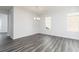 Bright dining room featuring hardwood floors and a modern chandelier at 1517 Ellie Ridge Ave, Lawrenceville, GA 30043
