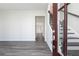 Inviting entryway featuring sleek gray hardwood floors and a modern staircase with iron railings at 1517 Ellie Ridge Ave, Lawrenceville, GA 30043