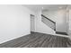 Modern living area showcasing sleek gray hardwood floors, white walls, and natural light at 1517 Ellie Ridge Ave, Lawrenceville, GA 30043