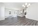 Spacious living space with a modern kitchen, dining area, and hardwood floors at 1517 Ellie Ridge Ave, Lawrenceville, GA 30043