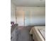 Bedroom featuring neutral carpet with a closet door at 536 Magnolia Cir # 116, Palmetto, GA 30268