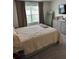Bedroom featuring neutral carpet and a large bed at 536 Magnolia Cir # 116, Palmetto, GA 30268