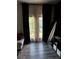 Living room with hardwood floors, modern dark curtains, and lots of natural light at 536 Magnolia Cir # 116, Palmetto, GA 30268